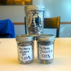 Mystery jewlery jars with pearl necklaces and other well conditioned bracelets.